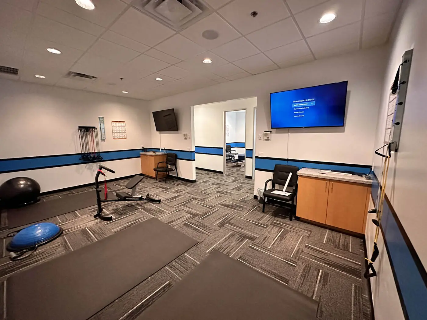 KTK Chiropractic therapy room with mats and exercise equipment